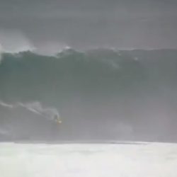 Surfers ride historic storm waves